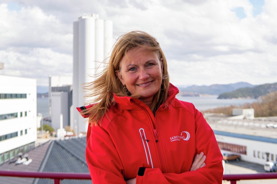 Therese Log Bergjord with Skretting Norway silo in the background